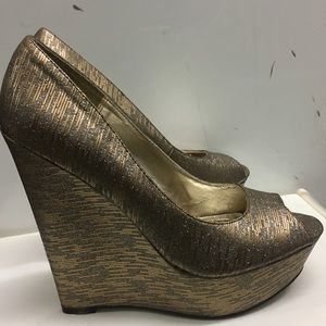 Steve Madden gold wedges.